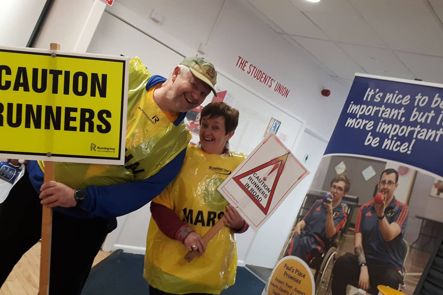 Frenchay-10k-fundraising Staff with banners and signs fundraising and supporting at the Frenchay 10k