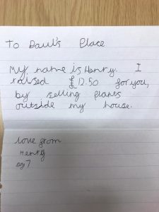 A personalised letter from Henry saying he has raised 12.59 for paul's place by selling plants outside his house.