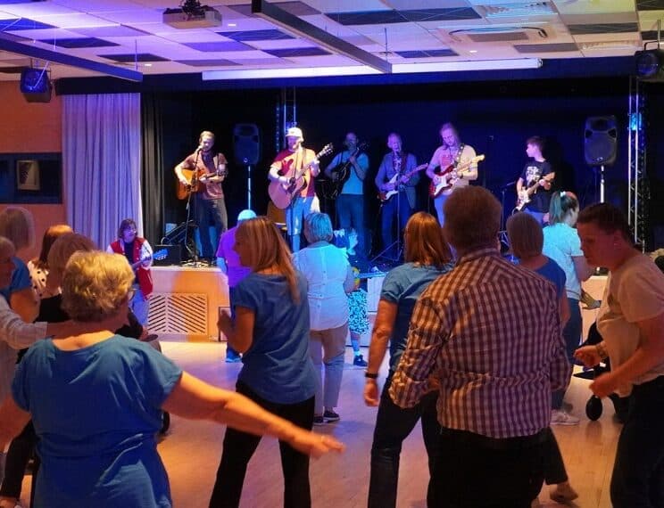 an image of a band playing to a crowd